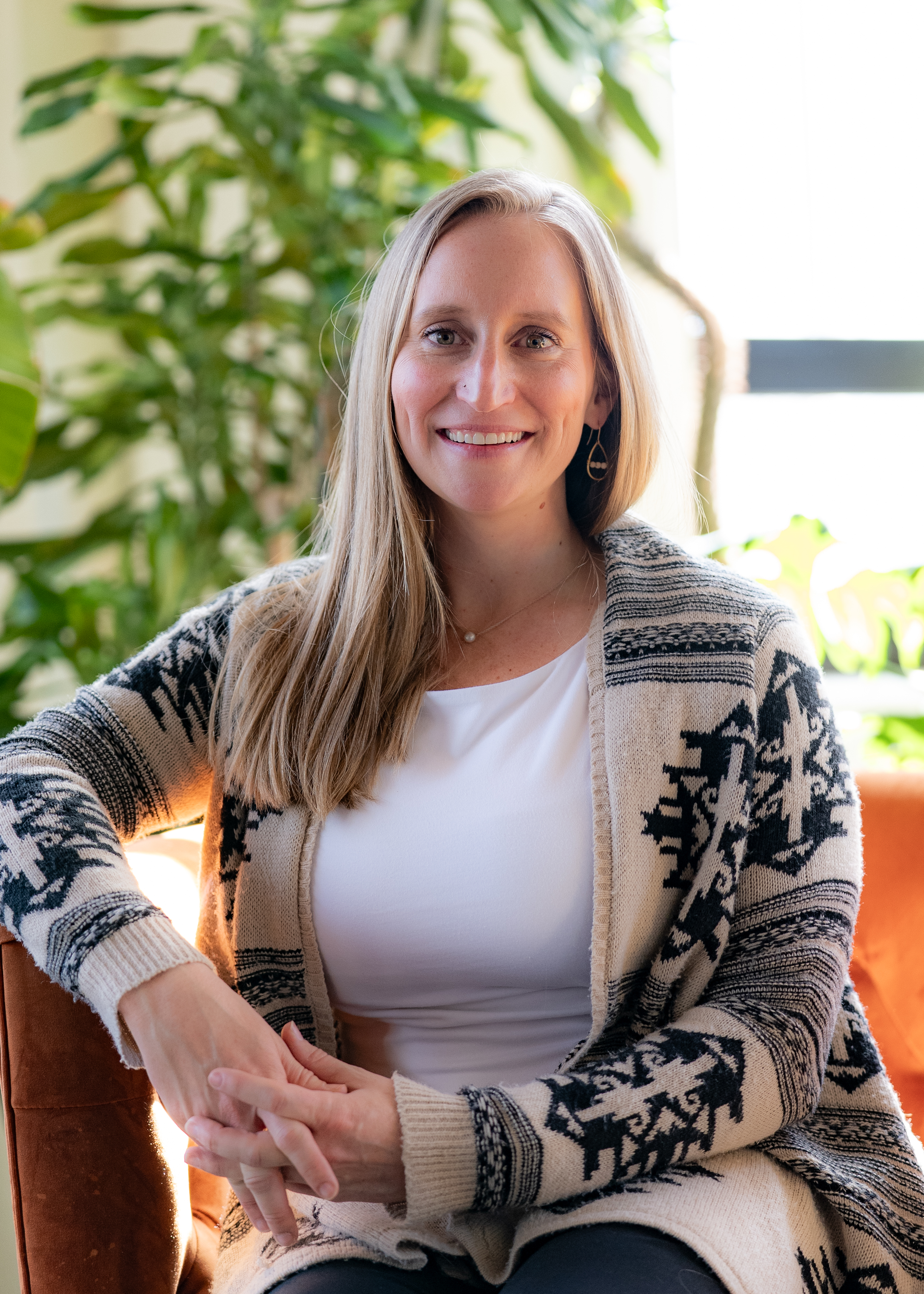 Ellen LeBleu, Registered Nurse and Board-Certified Nurse Coach, seated and smiling